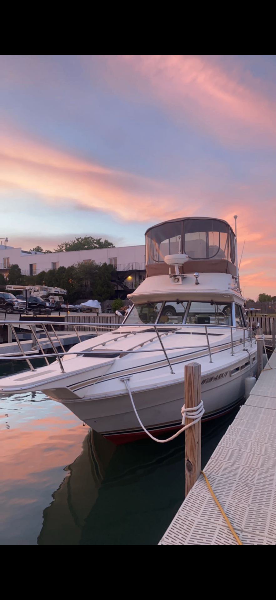 Yacht docked at the marina at sunset